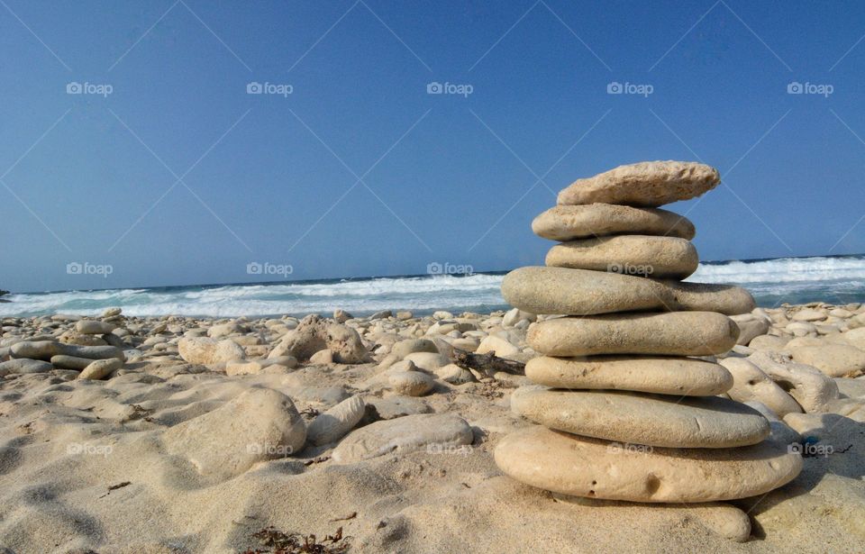 Rock stacking on Aruba beach 