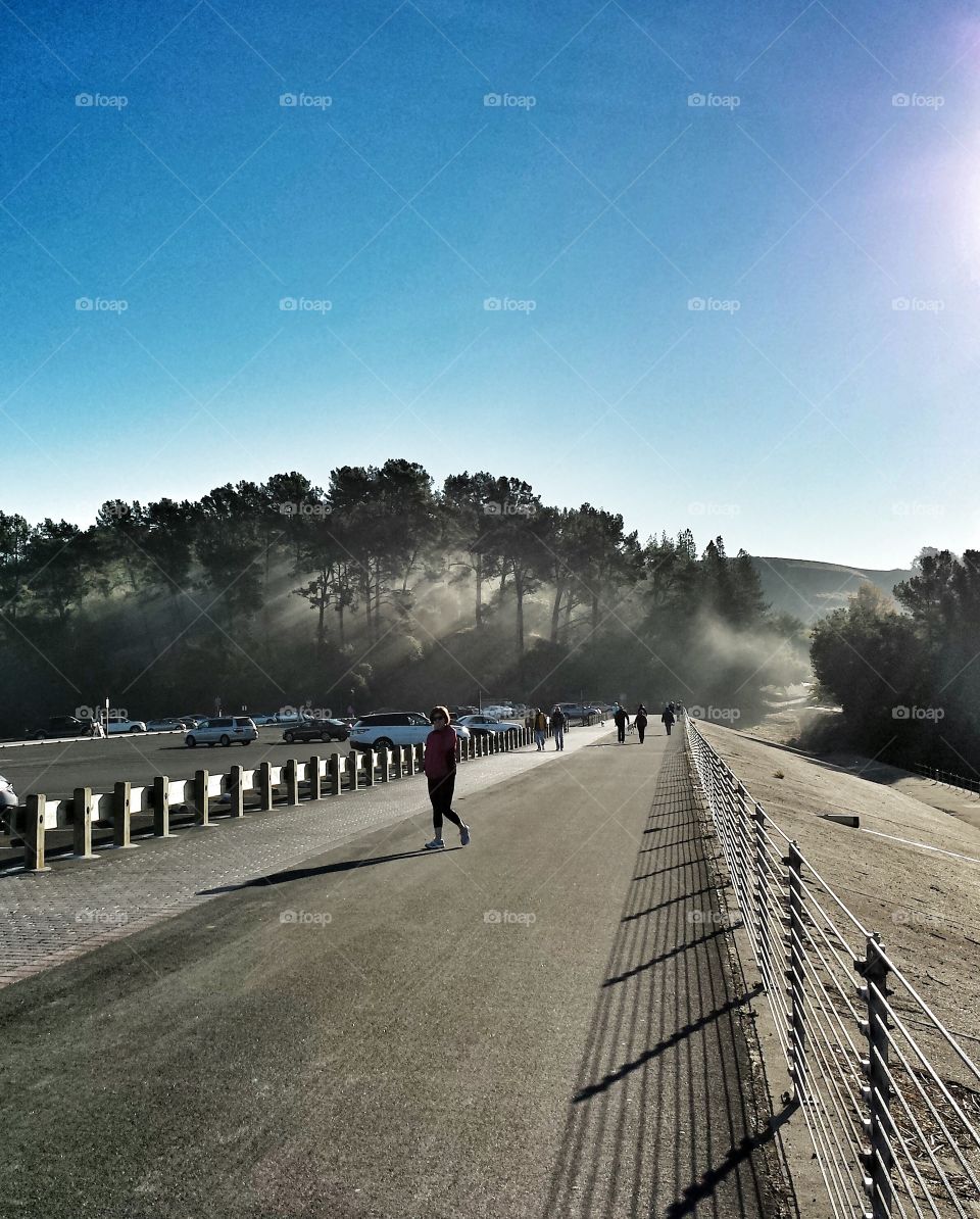 Peoples walking on road and car