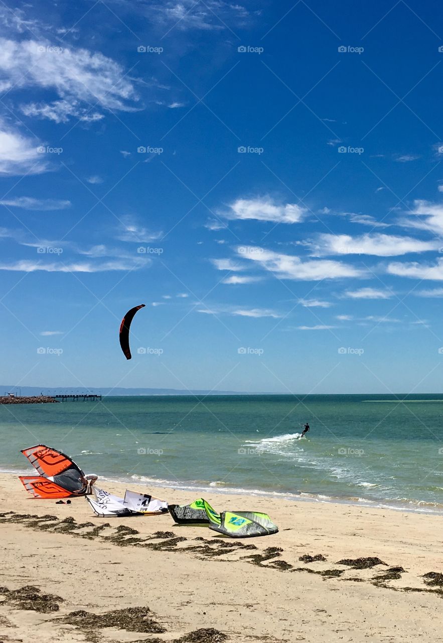 Kite boarders and kite boarding equipment on south Australia beach