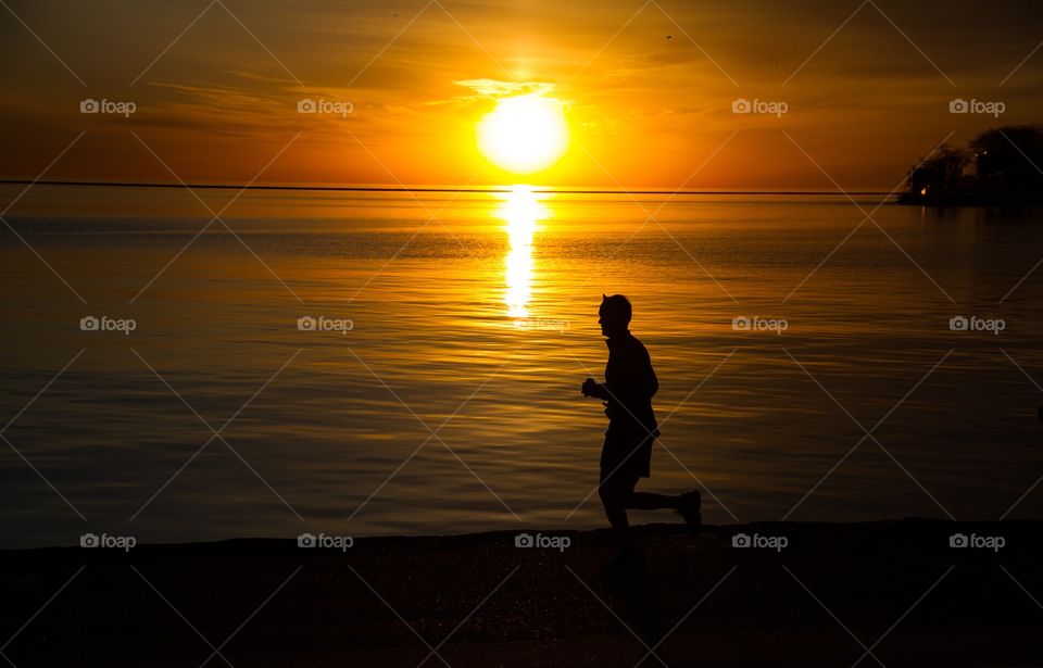 Lake Michigan . Early morning jogger along Lake Michigan in Chicago