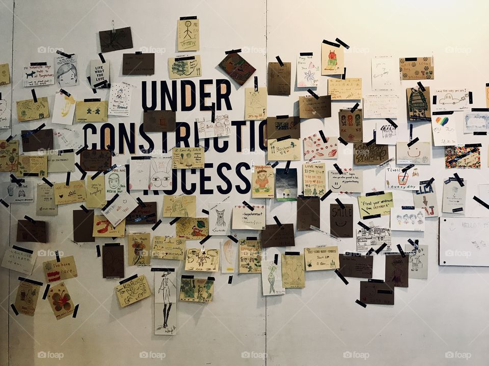 Post it on the wall note write sometimg