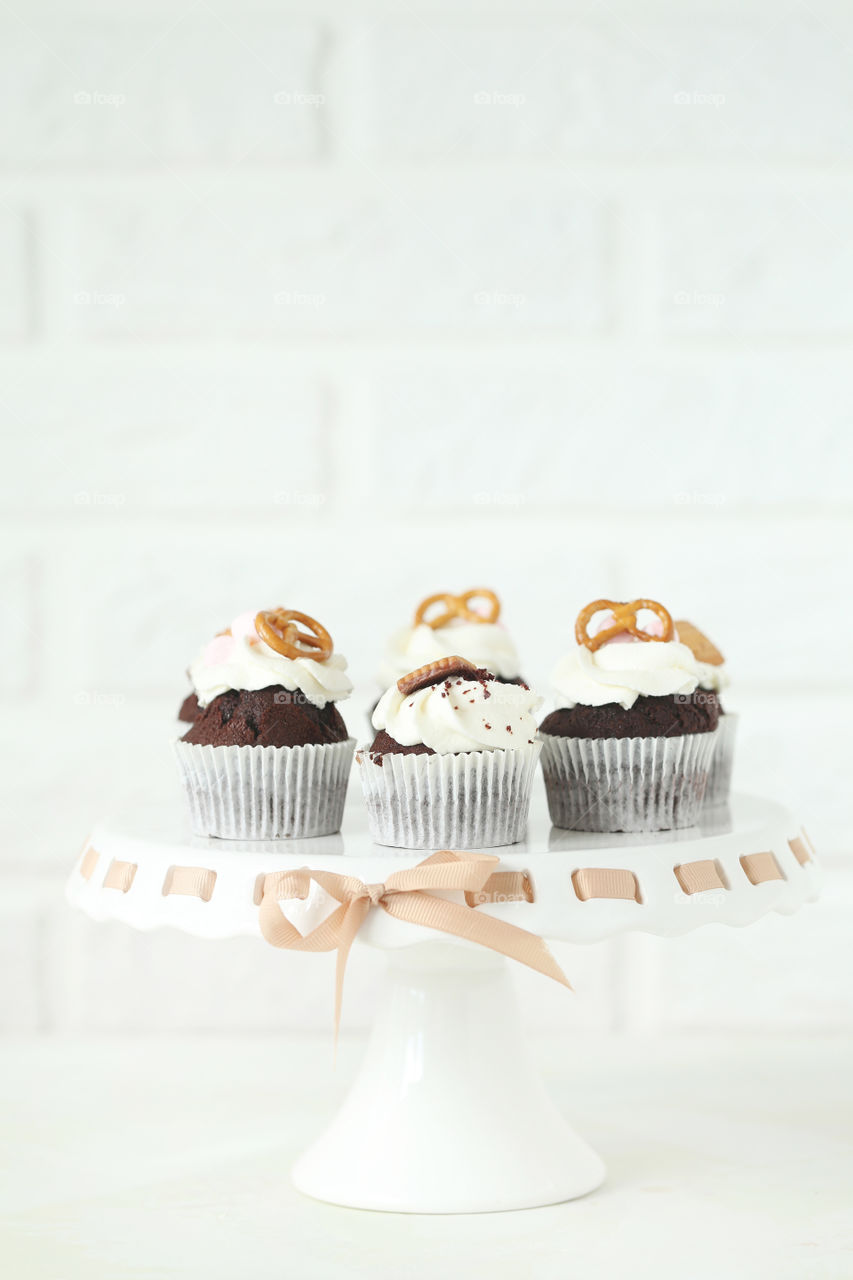 Delicious chocolate cupcake on white background 