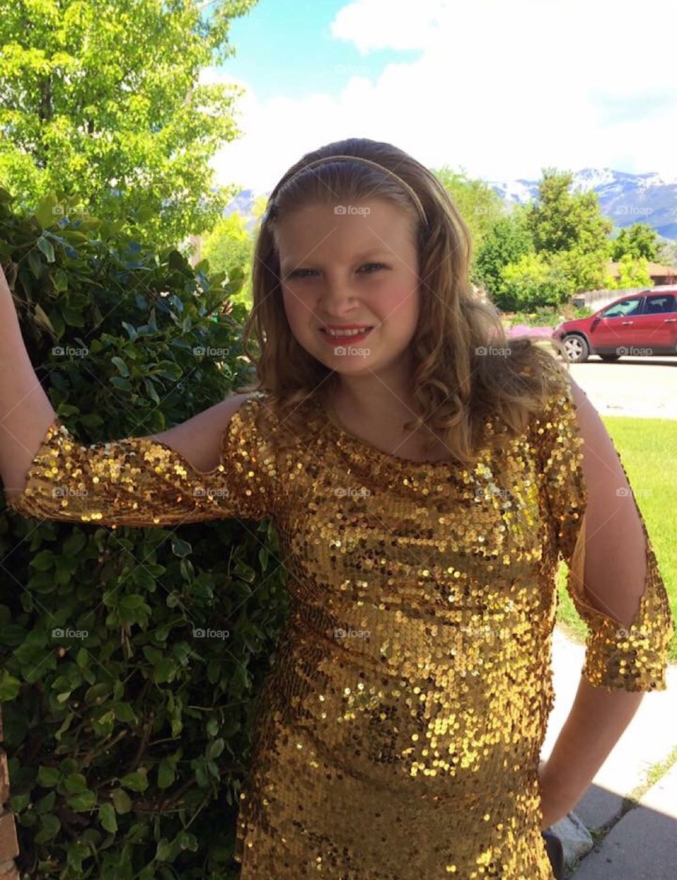 My lil’ poser in her gold sequins dance costume in the summertime.