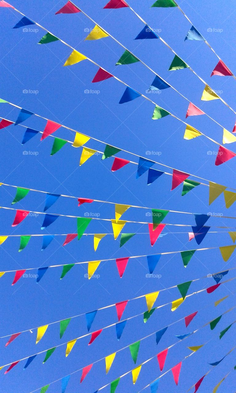 brightly colored bunting against a blue sky