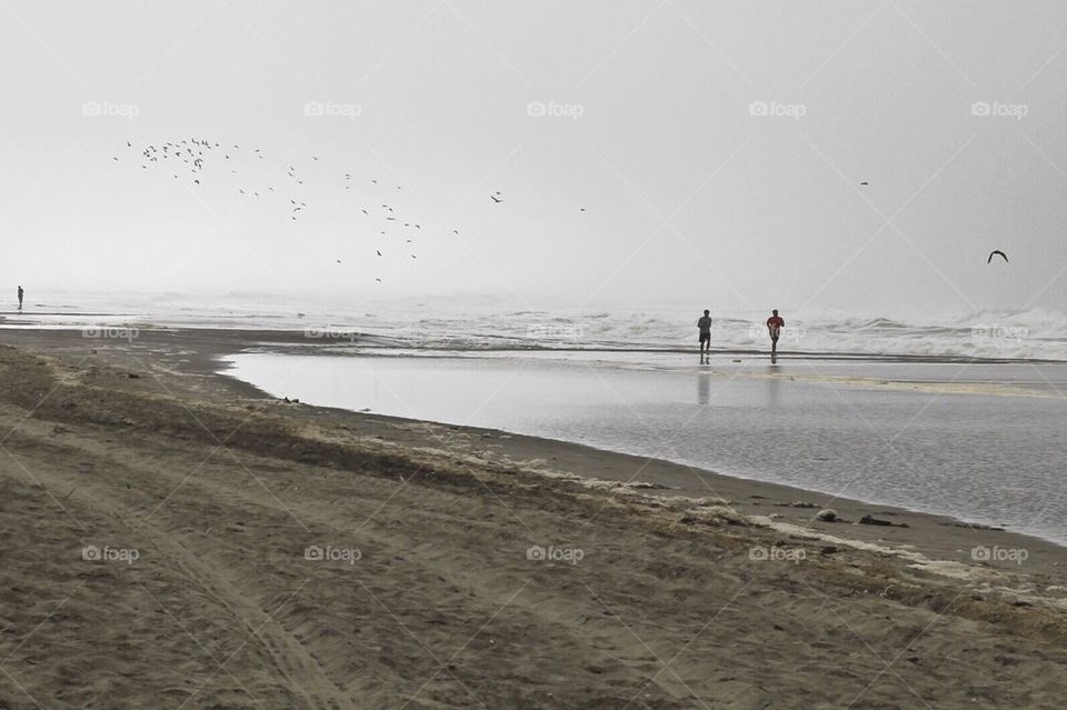 Joggers on the Beach