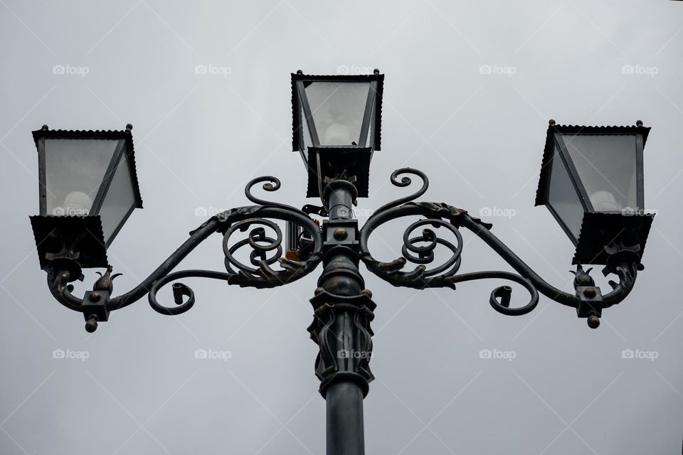 street lamp against grey sky ,bottom view
