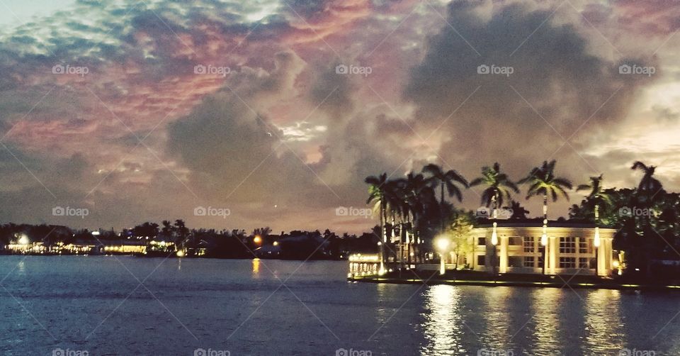Beautiful panoramic photo of one of the most expensive and amazing houses on Fort Lauderdale intercoastal/canal/river. Florida is beautiful 24/7 all seasons and weather, but the time of the sunset on one if the magical and warm fall nights brings special colors and atmosphere to the capture.
