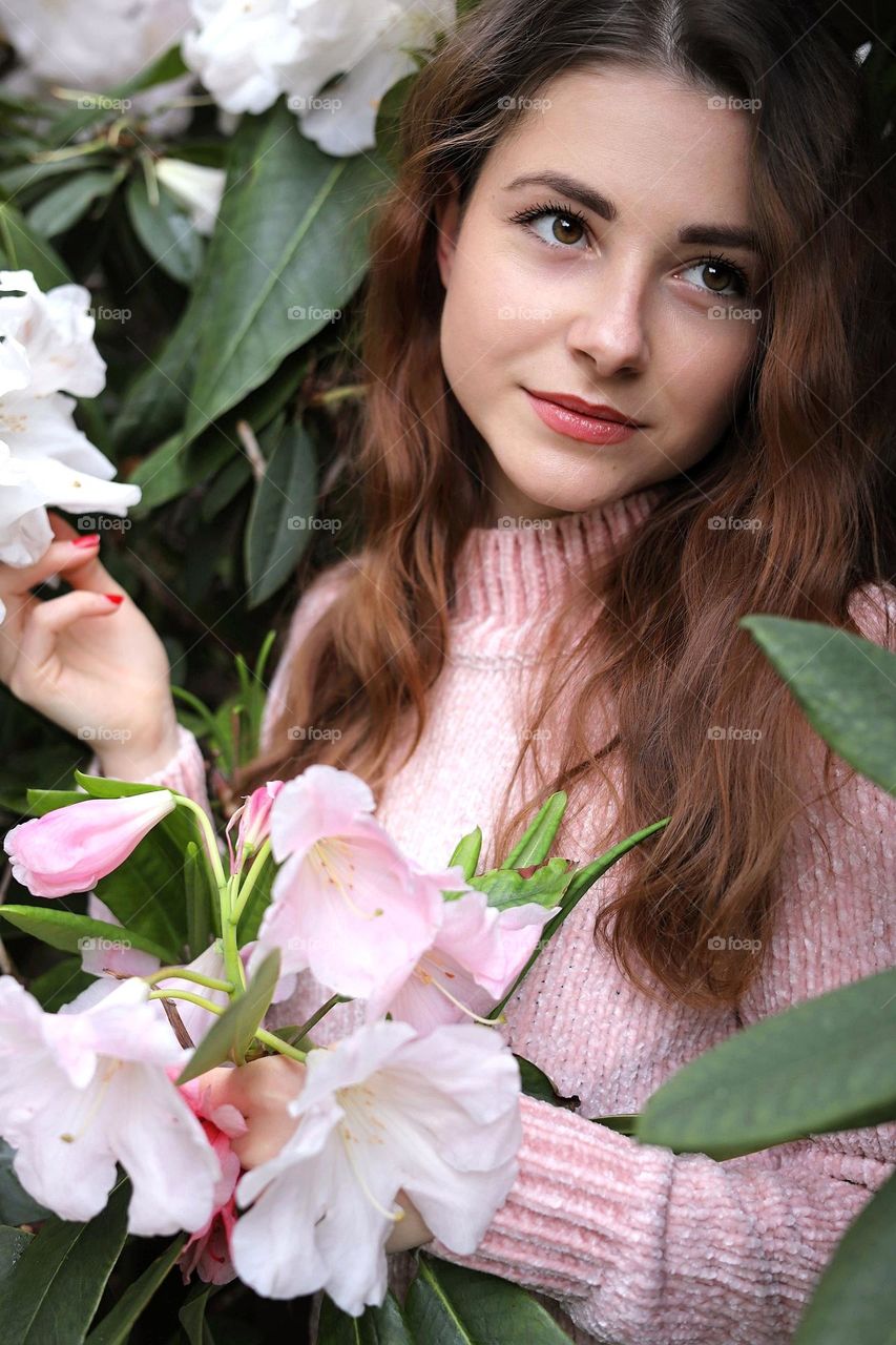 Beautiful young lady portrait. Natural beauty. Woman with flowers.