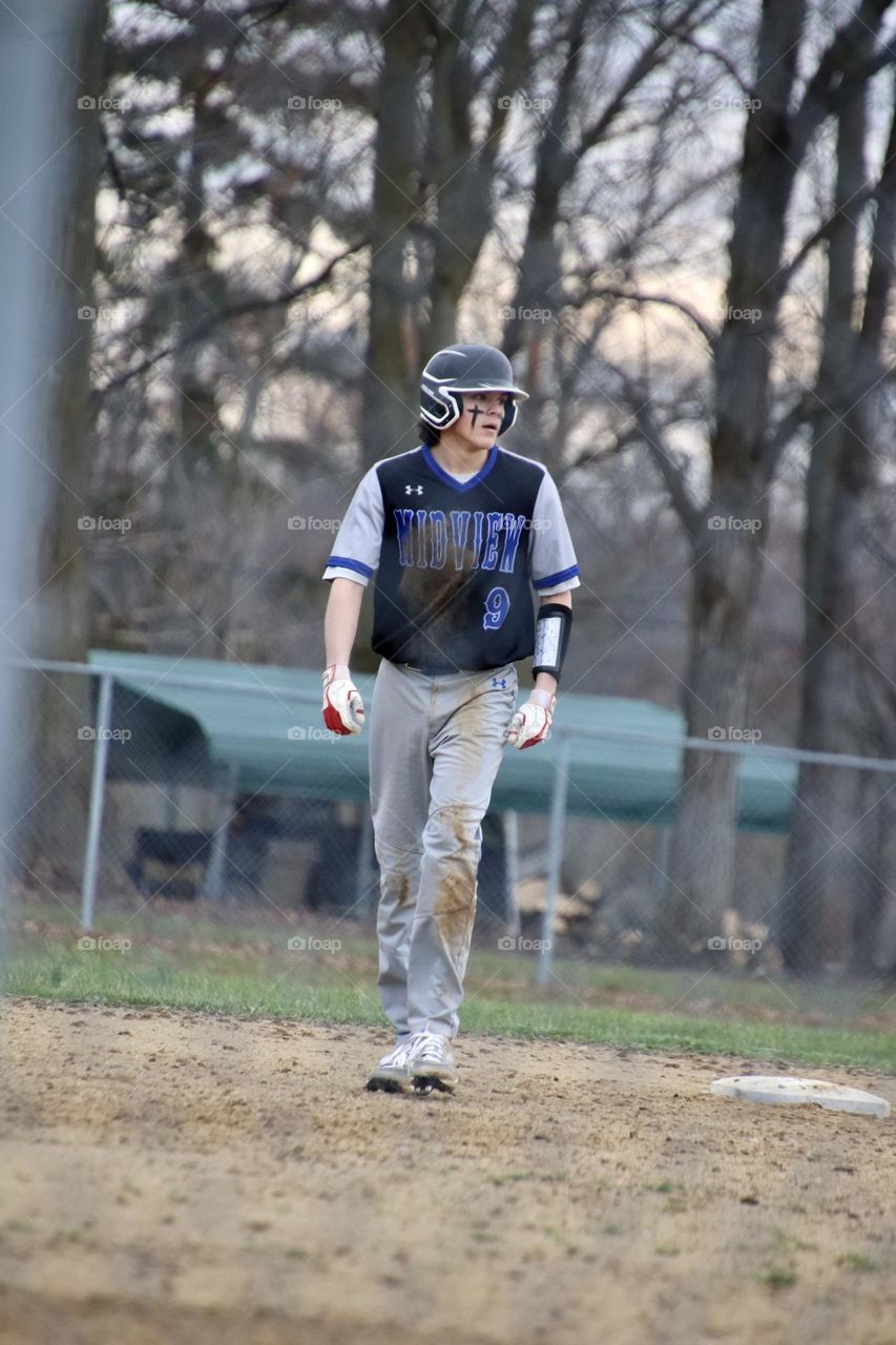 Baseball player leading off second base after getting hit high school baseball