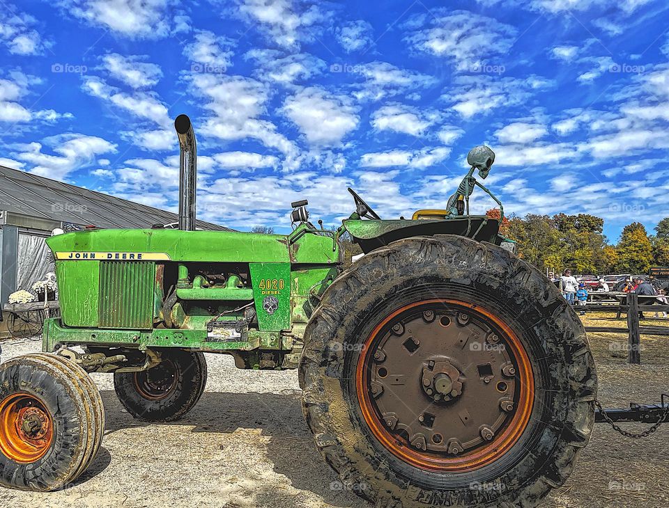 John Deere tractor on a farm in the Midwestern United States, farms of the United States, tractors on farms, farm life in the Midwest, blue skies and tractors, farmers life in Ohio