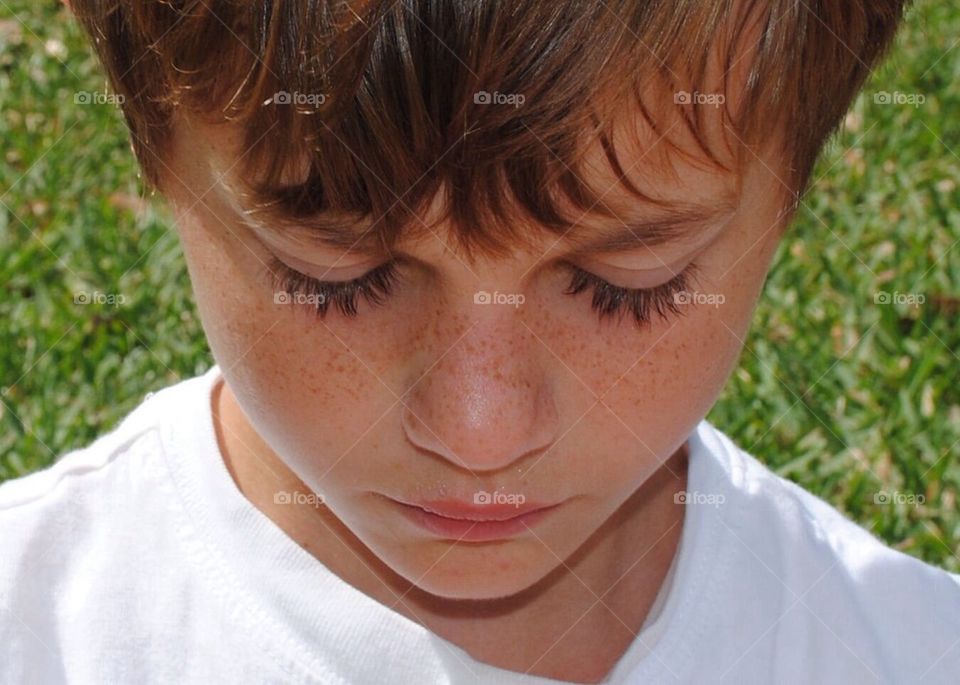 Lashes. Little sad boy with long lashes 