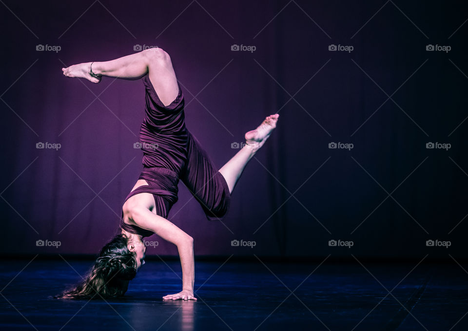 Woman Modern Dancer Doing Acrobatics On Stage
