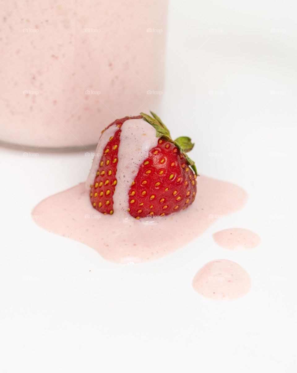 Studio photo of strawberry with liquid on