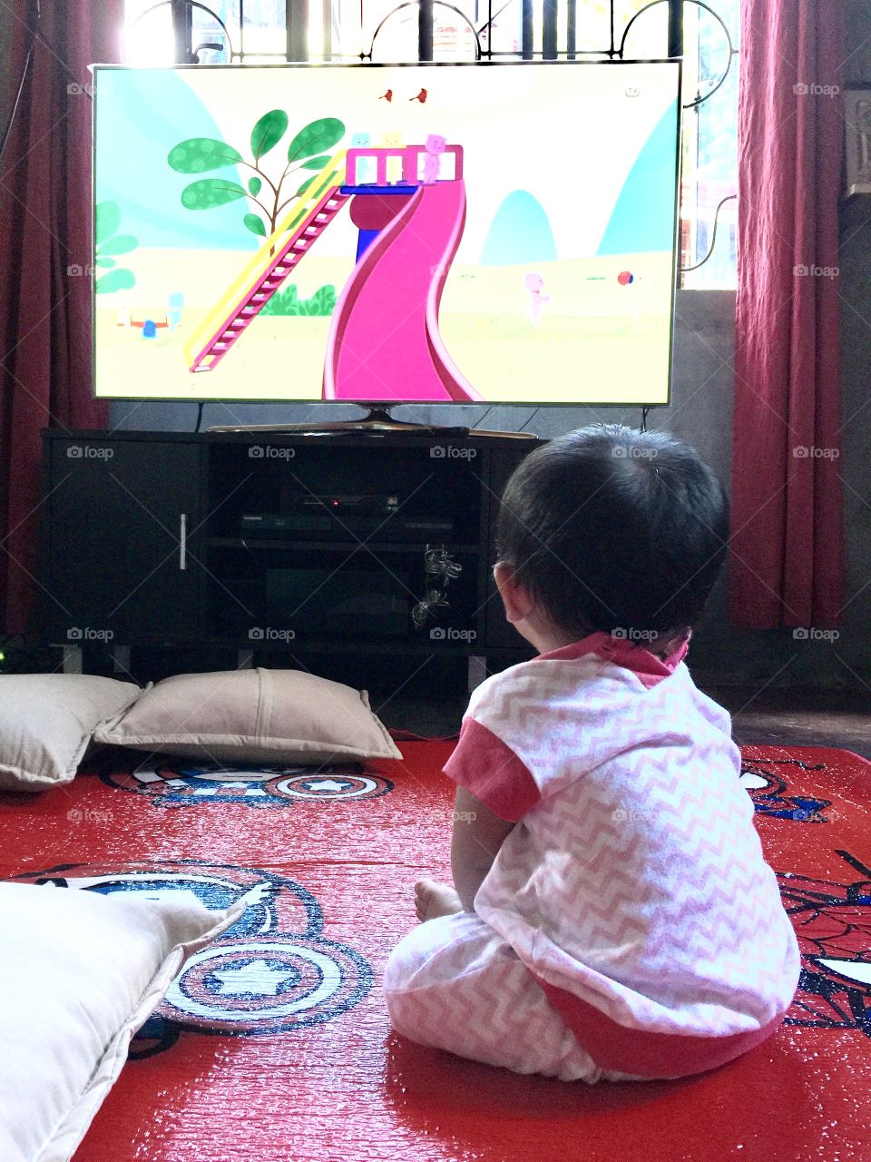 A baby watching television