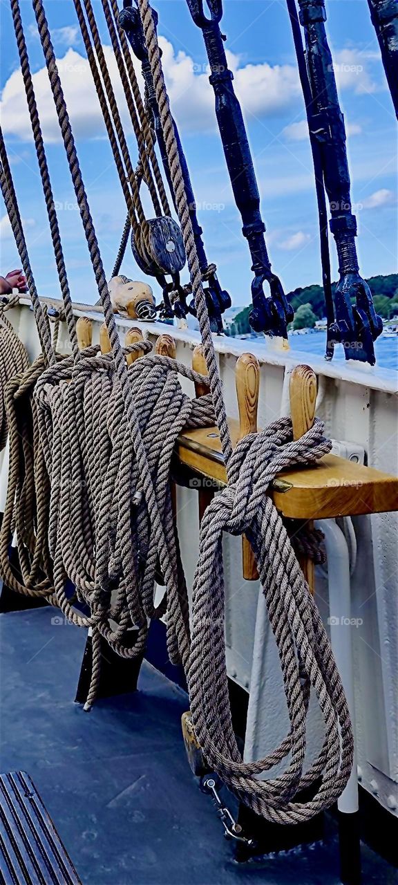 Aboard a big schoner everything has to be in „ship shape“ as they say. There is ample rope rolled around the wenches for every eventuality. She is here for the „Hanse Sail“, an annual regatta at „Rostock“ , Germany. 2023. Hypnotic Productions