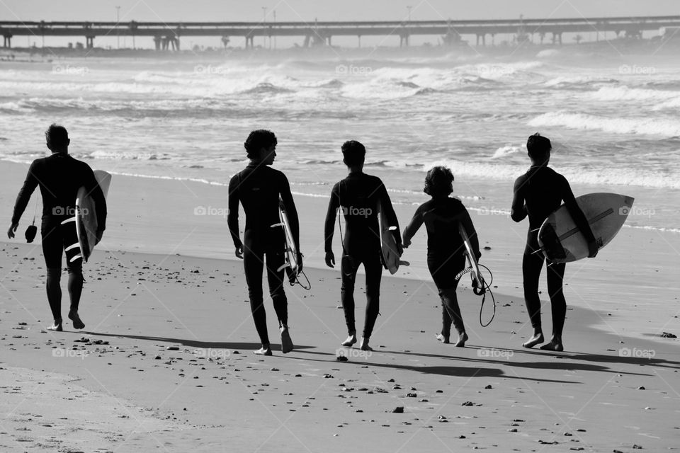 Group of surfers on the beach