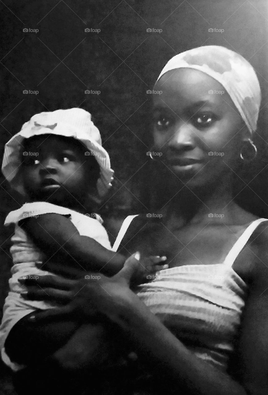 Young Black Woman with Baby