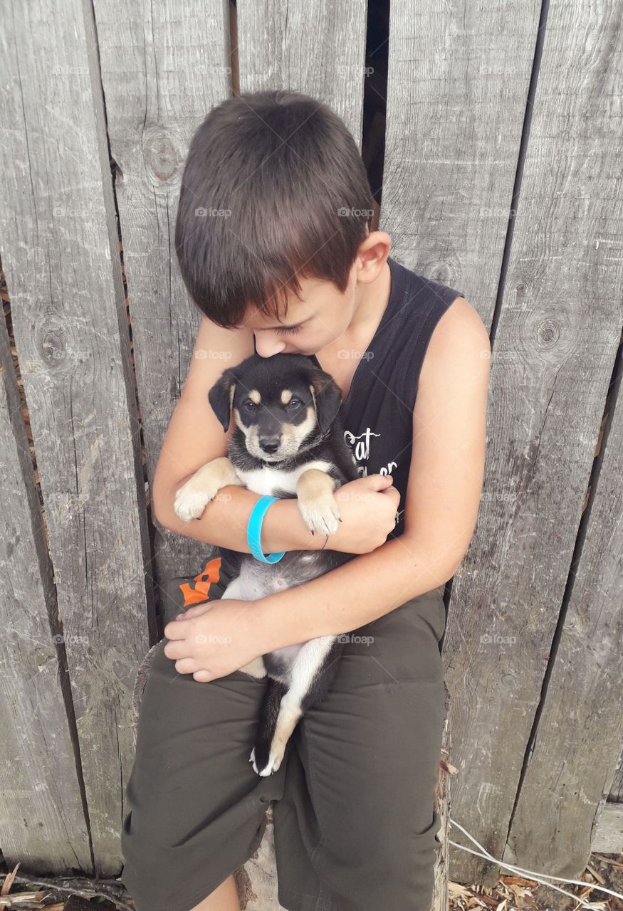 boy with a puppy