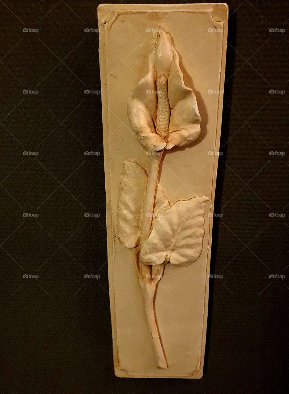 Art on a stone of a beautiful flower.