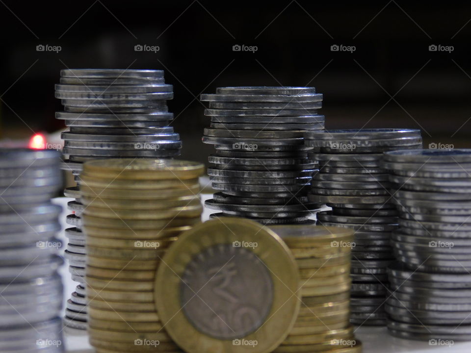 Indian Currency in Rupees - Coins are stacked with definite arrangement.