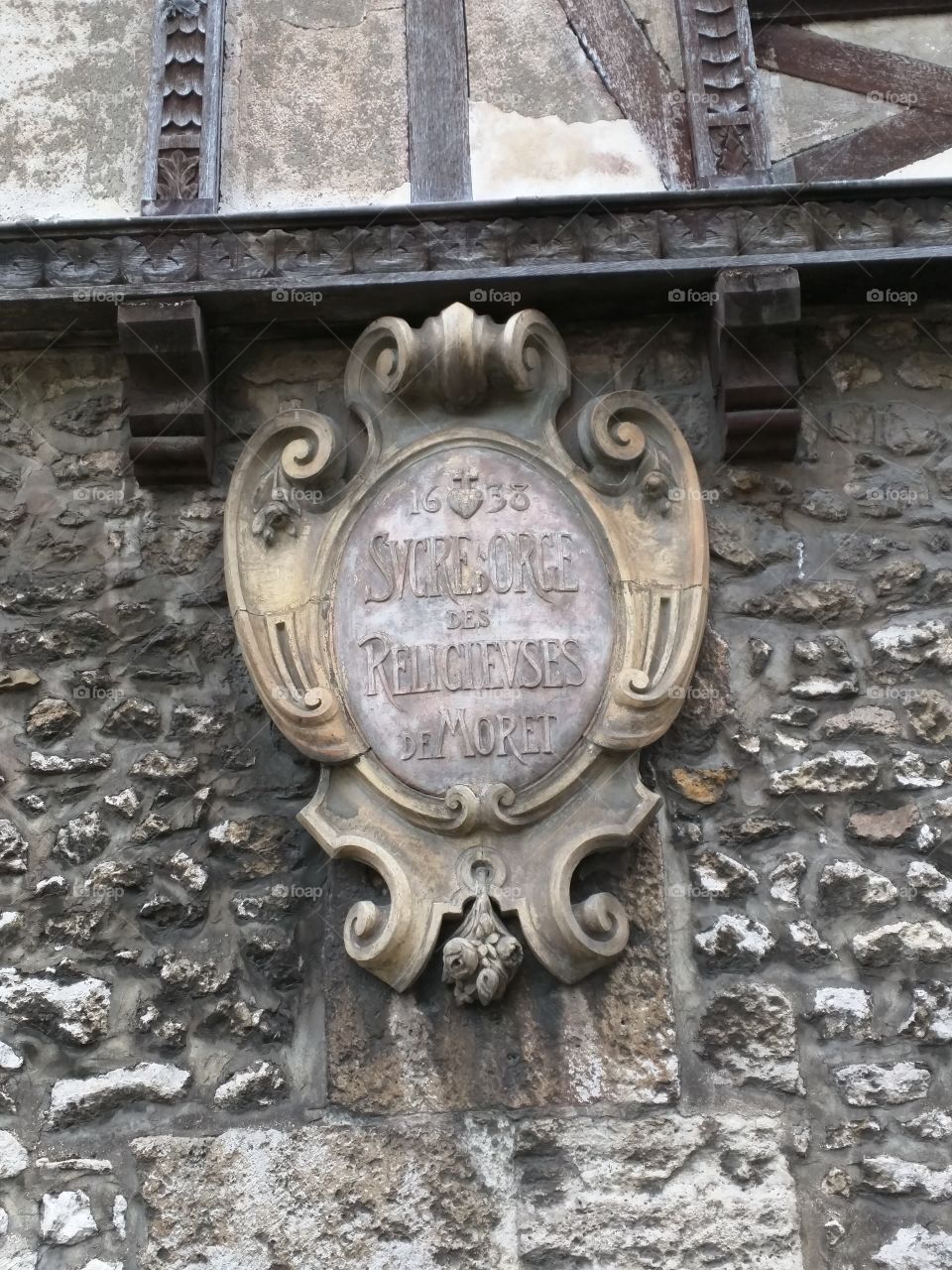 Coat of arms on the Maison du Sucre d'Orge (barley sugar) à Moret-sur-Loing, France