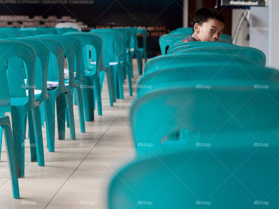 Blue chairs arrangement in a school hall