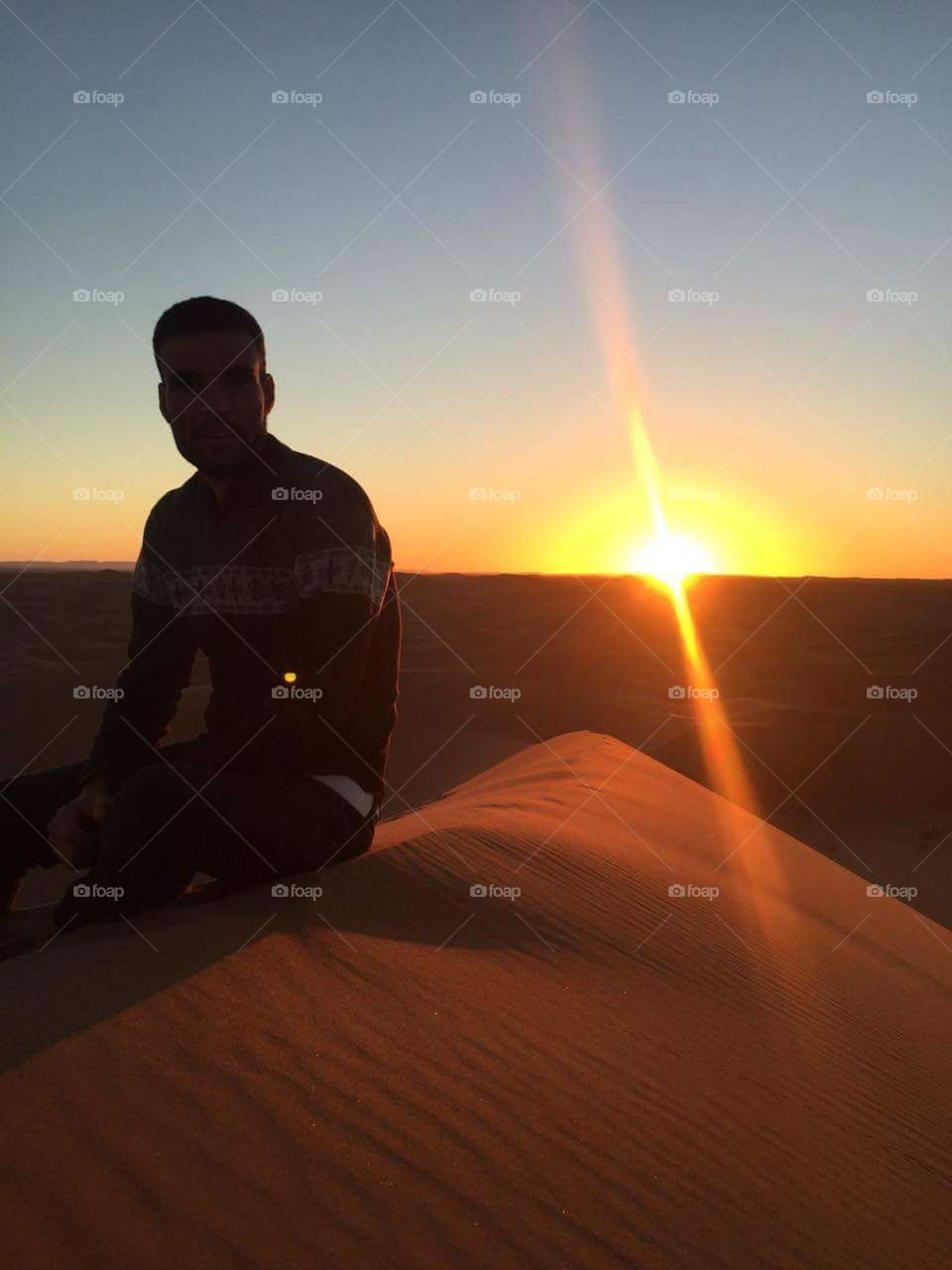 sun shining at sunset