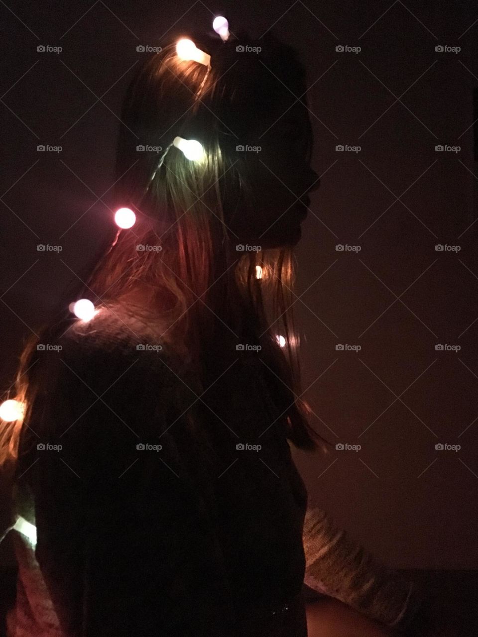 Woman silhouette with lights