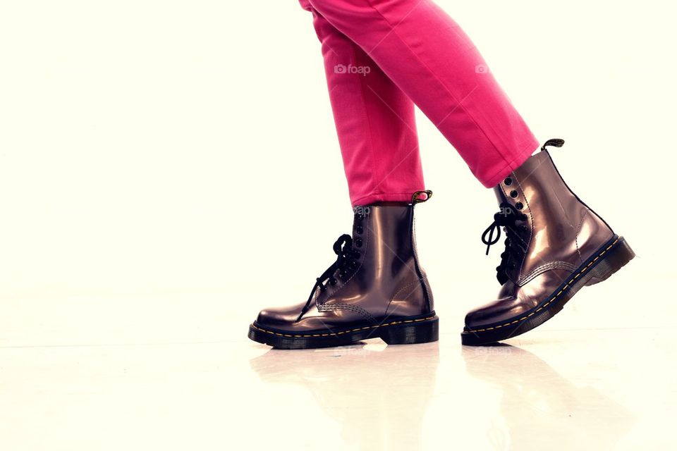 pink pants and shiny leather boots