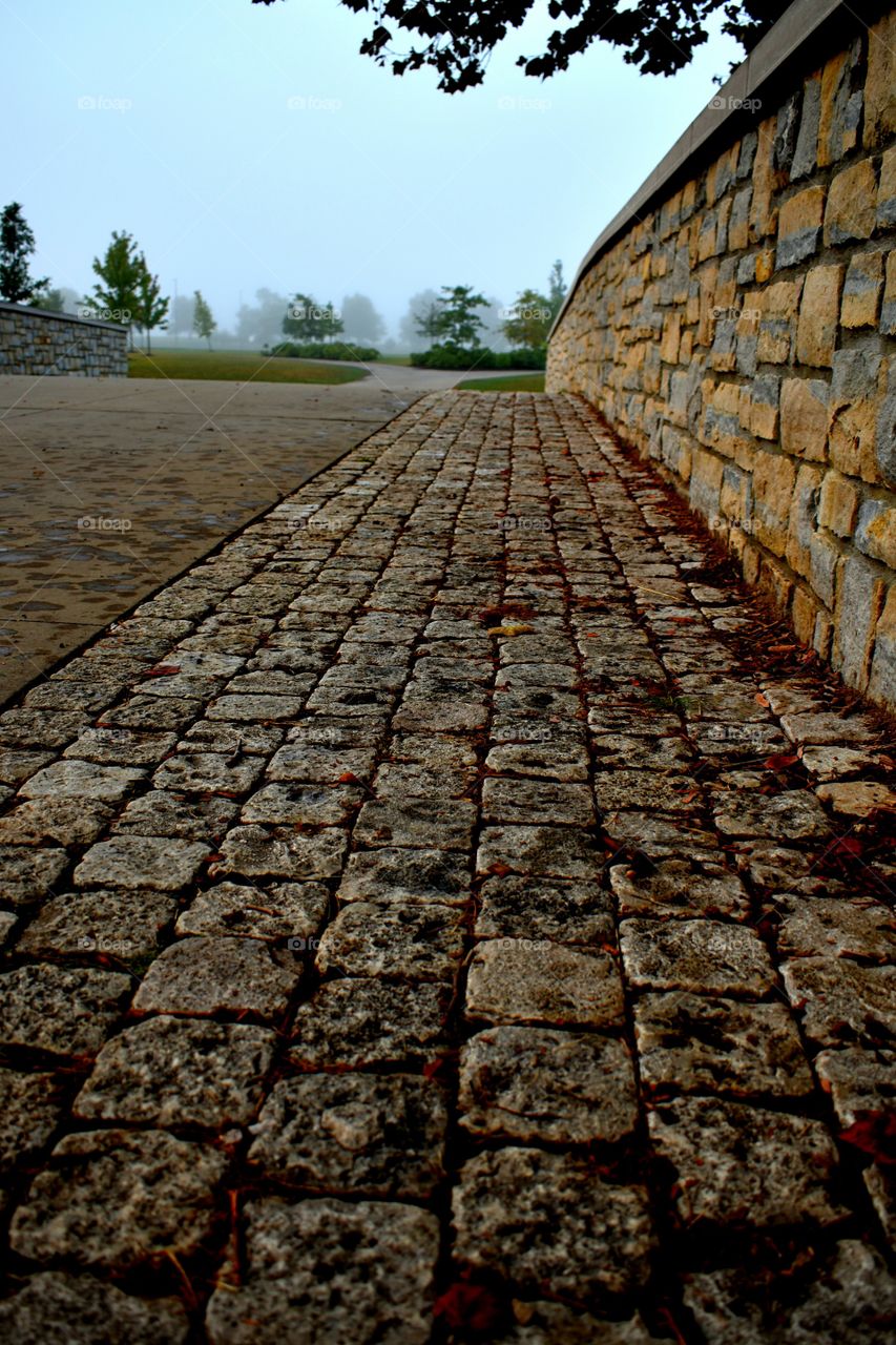stonework Bridge Park walkway fog trees