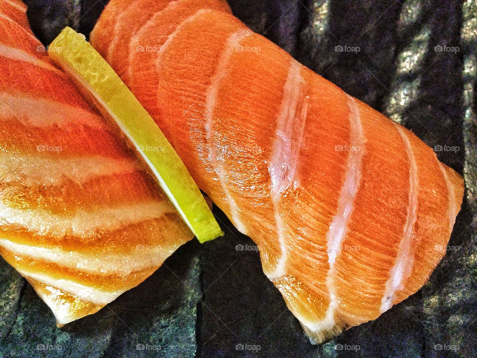 Fresh pink marbled fatty tuna toro sushi nigiri at Japanese restaurant