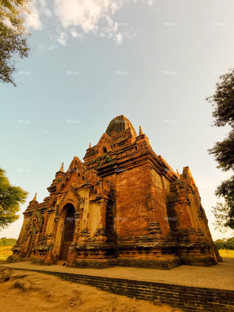 A golden pagoda in the late afternoon in Bagan, Myanmar. The color of these temples change constantly throughout the day.