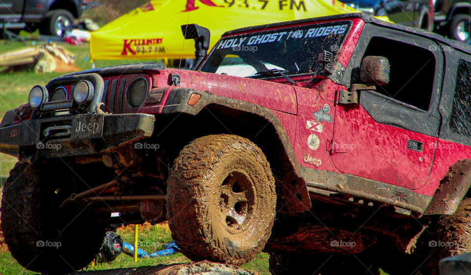 Off-road rally. Tackling man-made obstacle course

