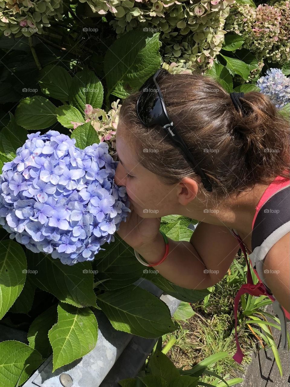 Girl smells the flower , Azores Islands , Portugal