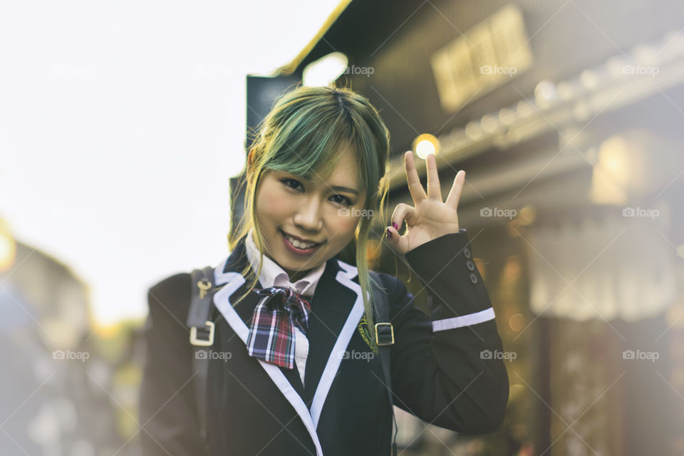 Portrait of Japanese school girl cosplay in the street of Kyoto