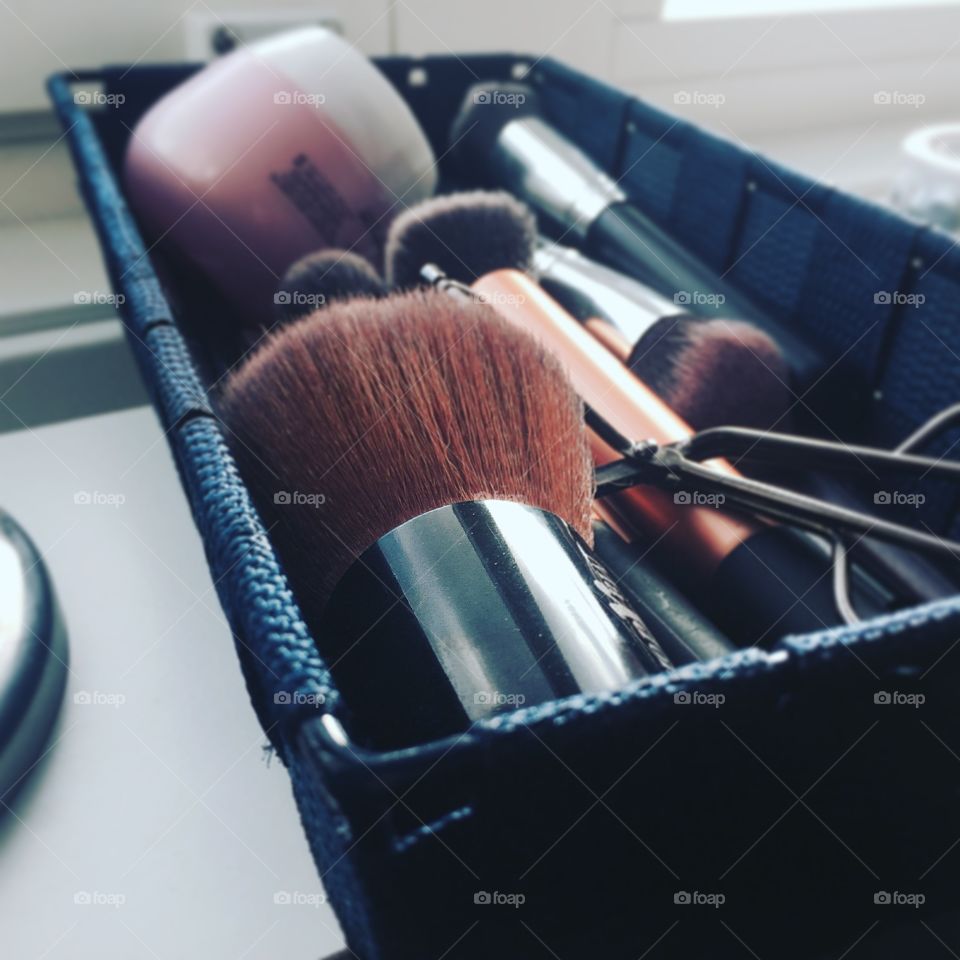 Make-up brushes on container