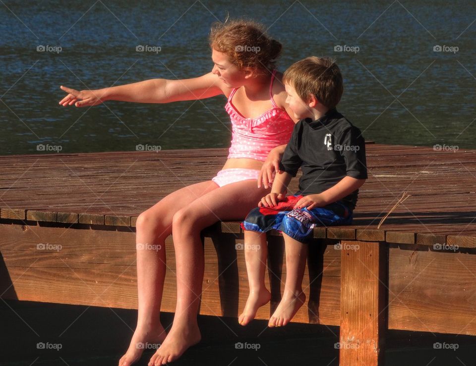 Love Of An Older Sister. Big Sister And Little Brother In Simmer Vacation By A Lake
