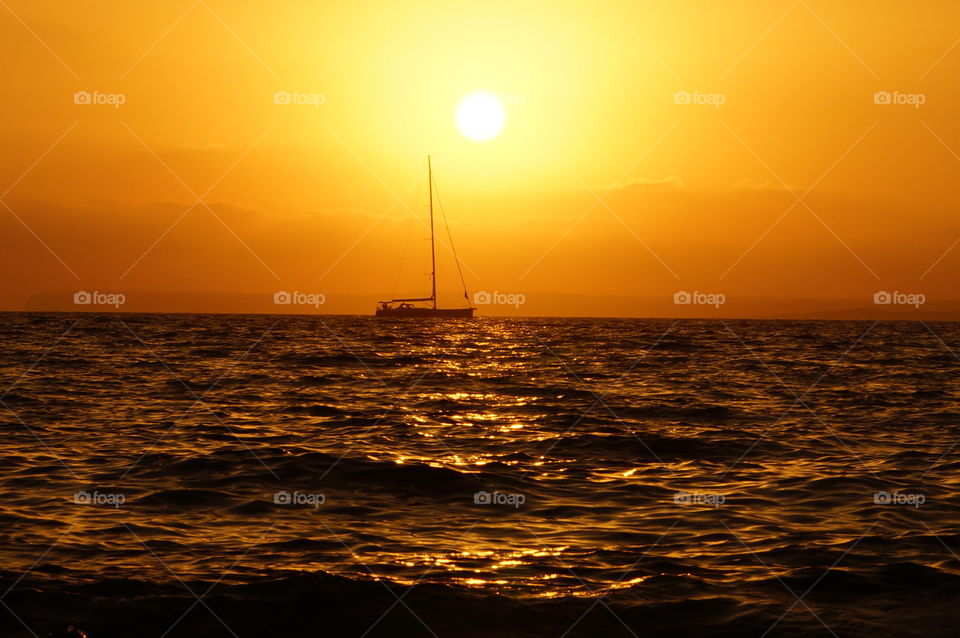 A sailboat and the sunset