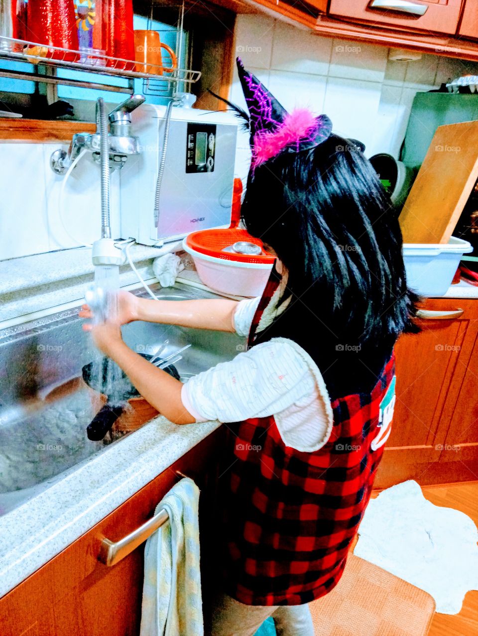 she's the little girl who's unable to see but she loves water. 
this time she's learning how to wash dishes and she's pretty much smart to learn so fast.
Most of all, she's enjoying and loving it so much.
Nothing can  compare the joy in her heart.