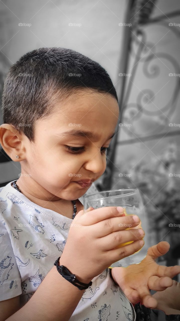 cute juice drinking boy