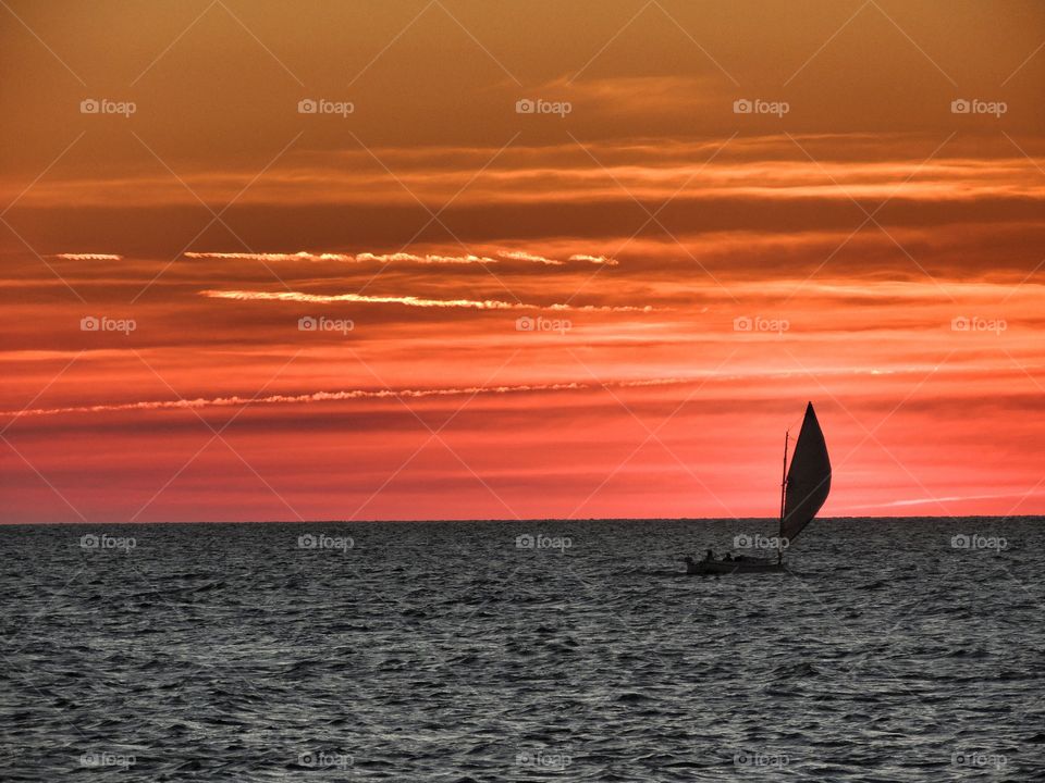 Distant view of sailboat in sea