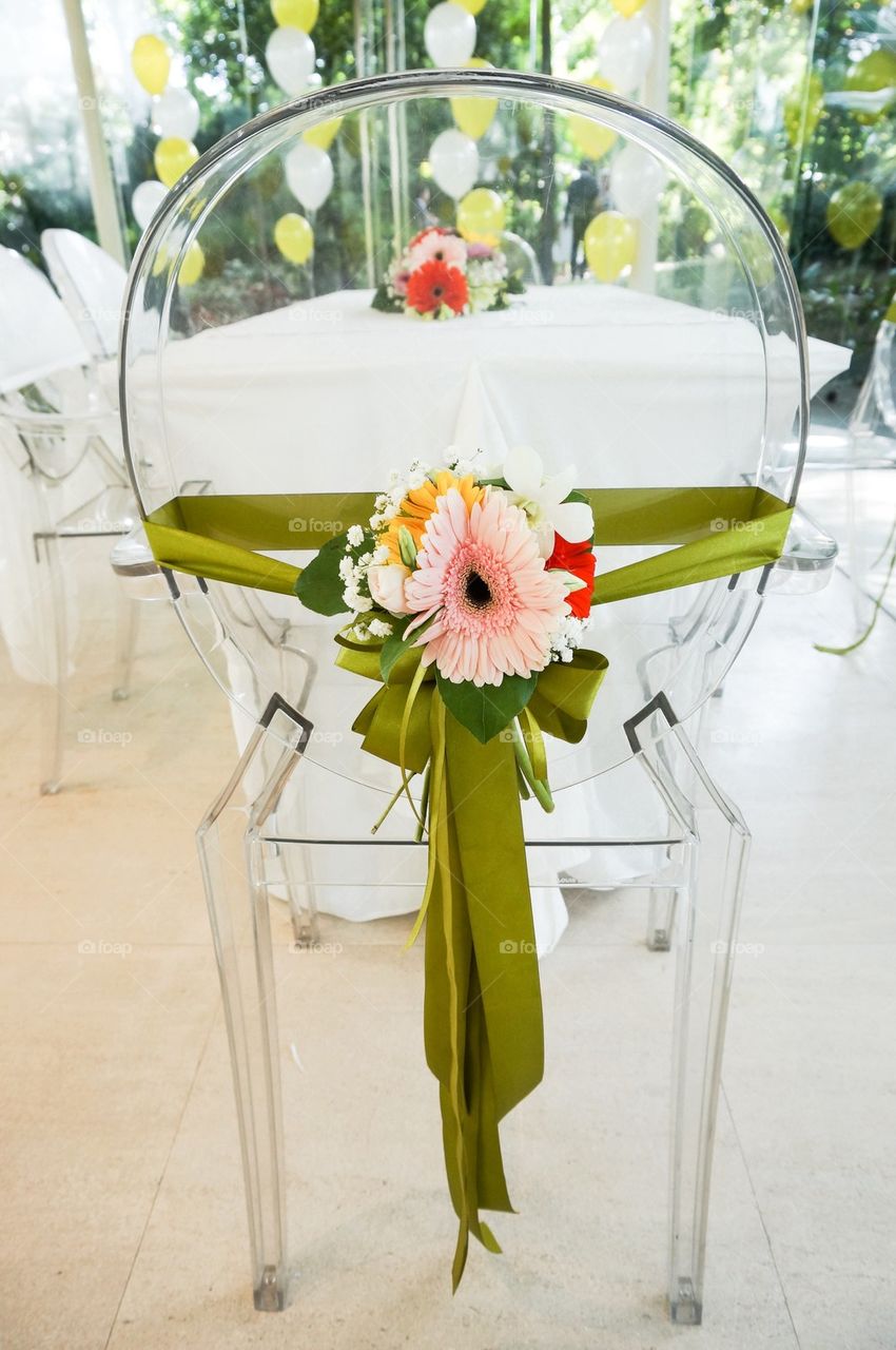 Chair with ribbons and flowers decor