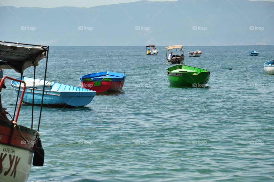 colorful boats in fair weather sea