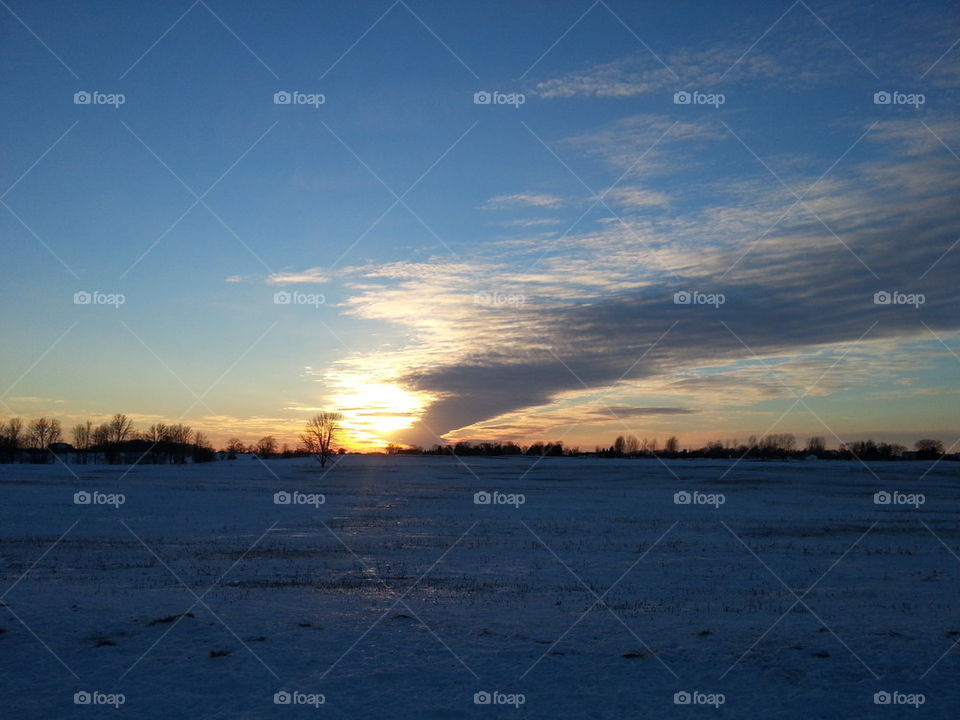 wisconsin winter sunset. driving