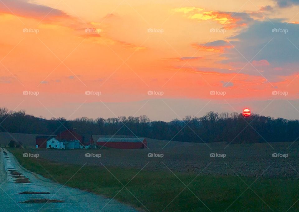 Welcome home to the farm at sunset on a seasonal winter evening