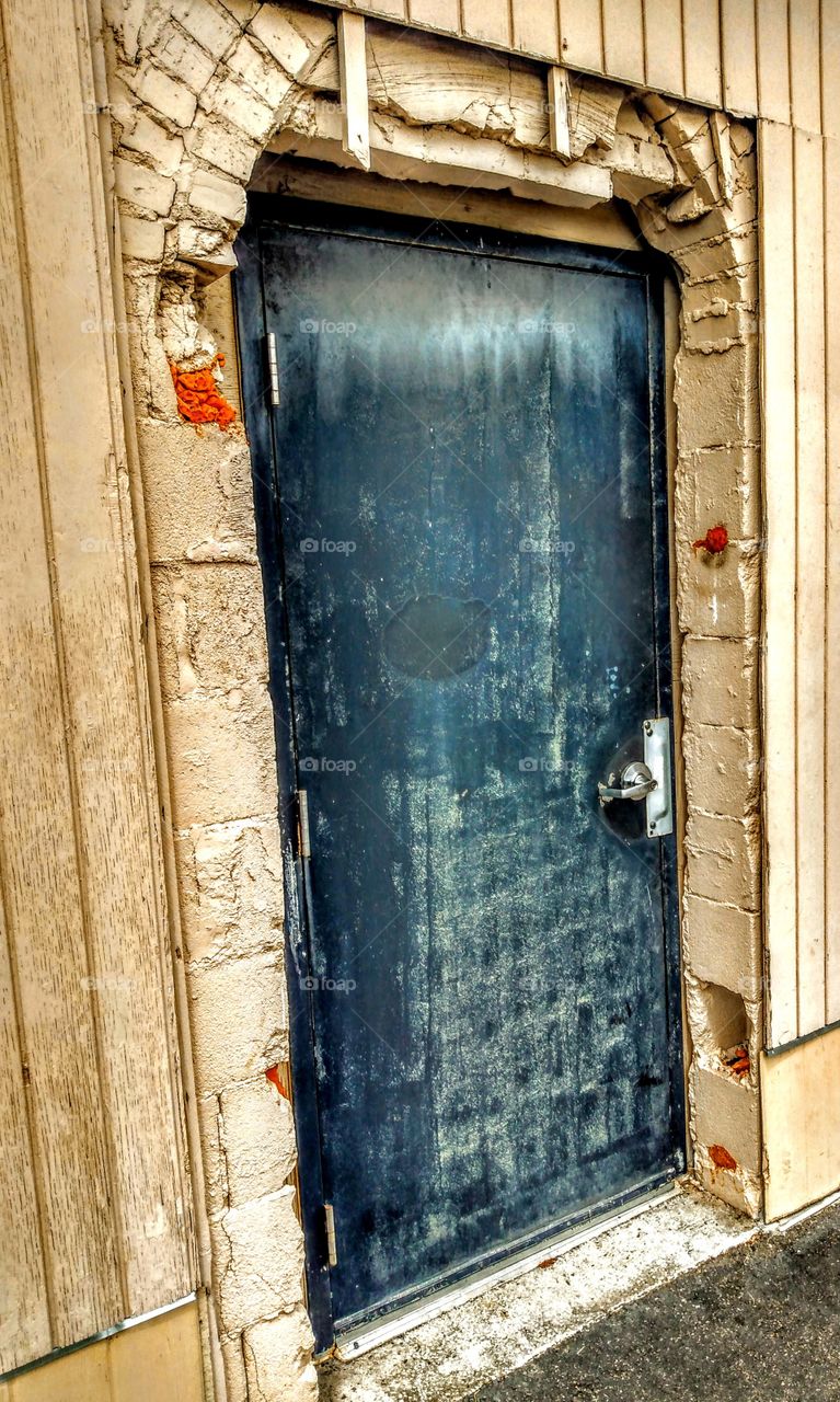 old storage shed with steel door