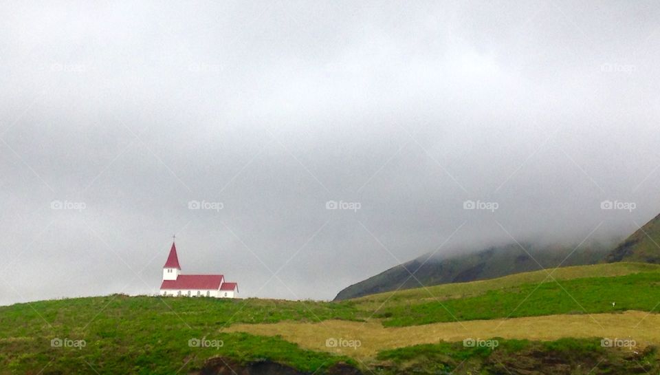 Visit card of Iceland. Church in the village Vik. 