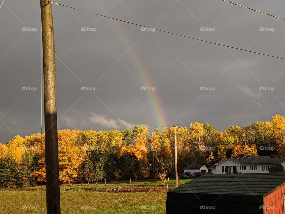 Cloudy afternoon rainbow after the storm.