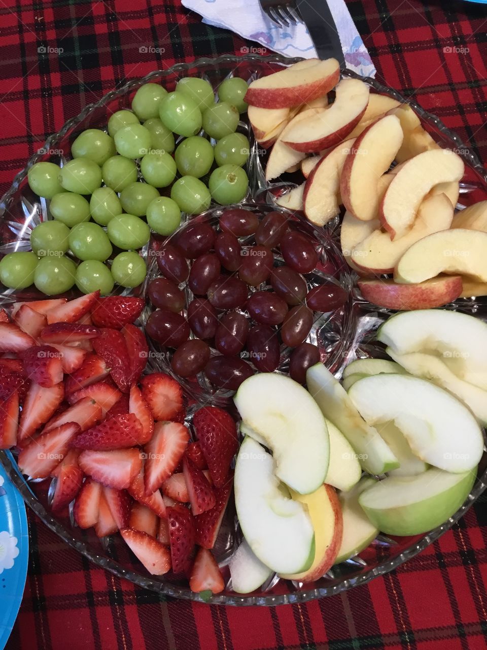 F - Fruit  Colorful and healthy fruit tray to snack on. Rich in vitamin C. Green grapes, red grapes, green apples, red apples and strawberries 