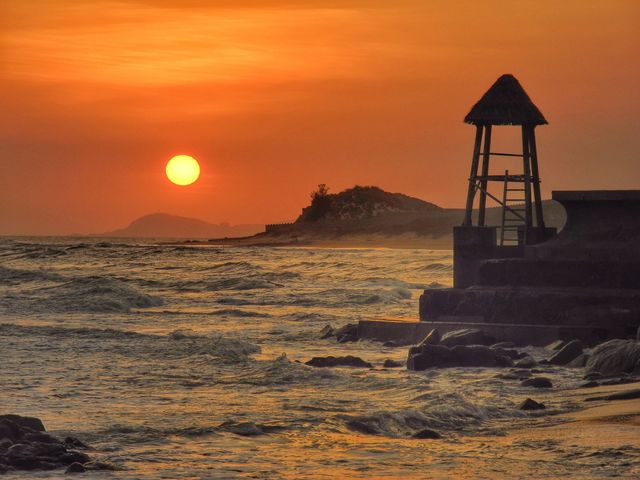 Watching tower on the beach.  Sunset time. 